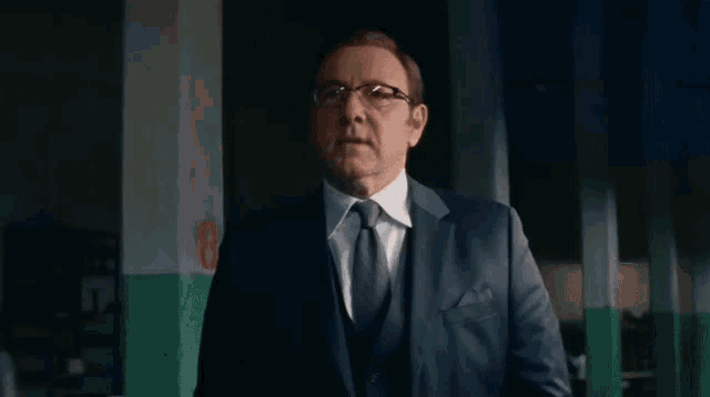 a man in a suit and tie stands in front of a screen that says you 've gone incognito