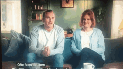 a man and a woman are sitting on a couch with the words ofte fales det som on the bottom