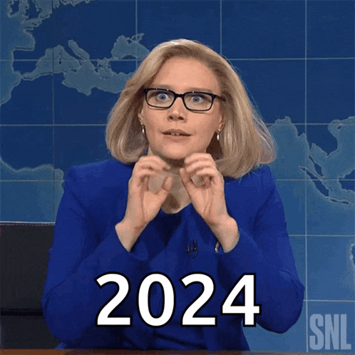a woman in a blue suit and glasses says 2024 in front of a map