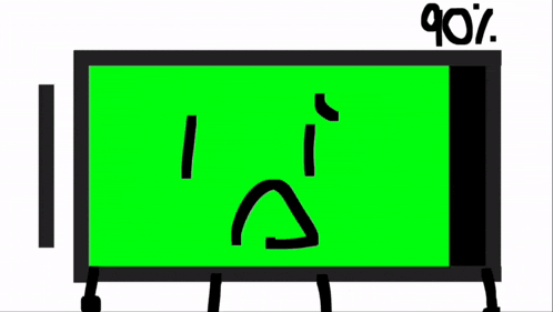 a green screen with a sad face on it is sitting on a table .
