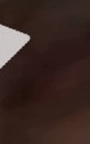 a close up of a piece of brown leather with a white stripe .