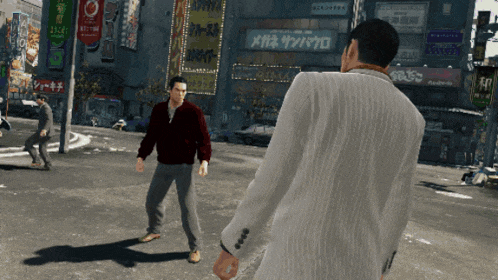two men are standing on a street in front of a building with a sign that says ' メガネ サンバウロ '