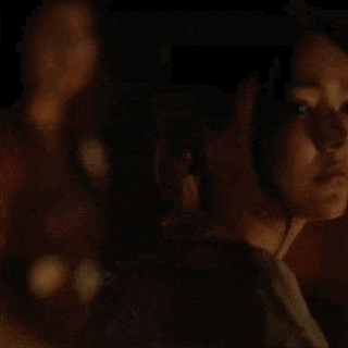 a close up of a woman 's face in the dark