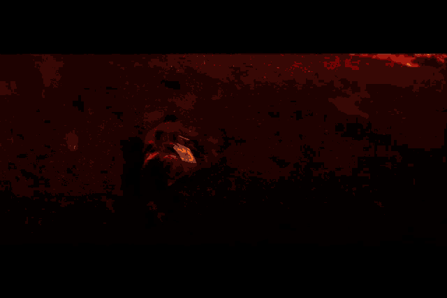 a person laying on the ground in a dark room