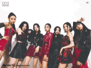 a group of women standing next to each other with the number 003 on the bottom left