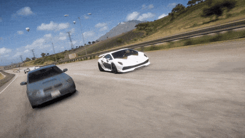 a few cars are driving down a road and one of them has a license plate that says ' california ' on it