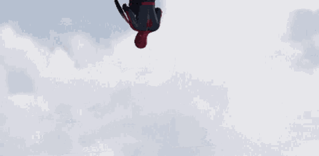 a man in a spider man costume holding a shield