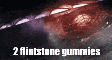 2 flintstone gummies written on a dark background