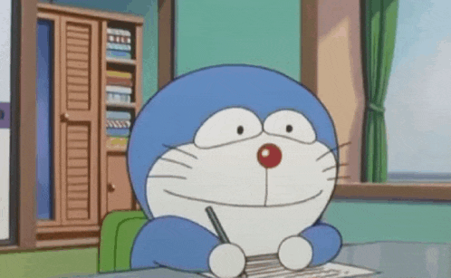 doraemon is writing on a piece of paper with a pen .