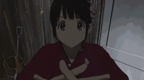 a girl with a flower in her hair is wearing a kimono