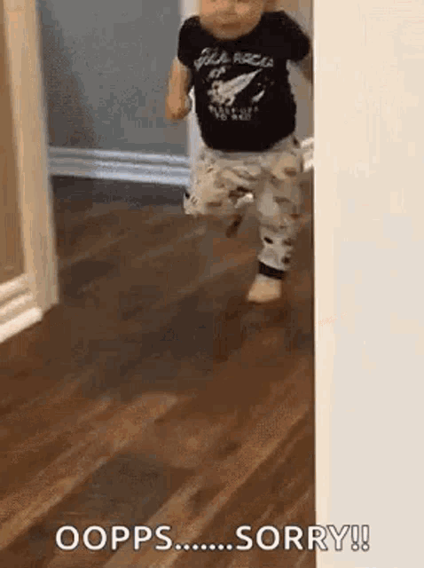 a baby is walking through a doorway .