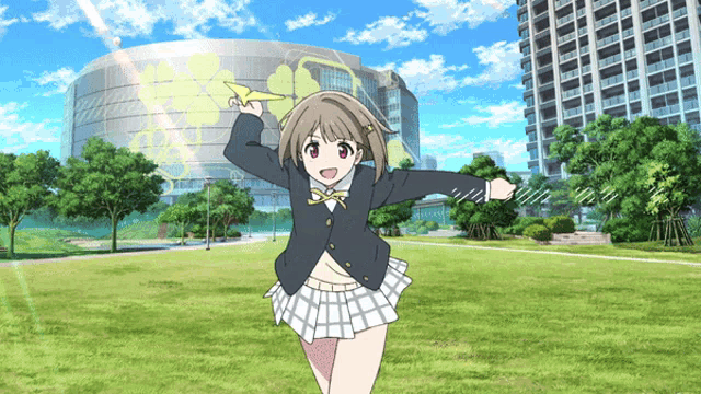 a girl in a school uniform is holding an airplane in front of a large building