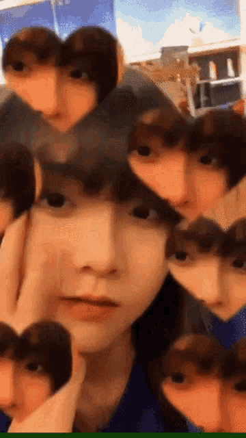 a person with many faces on their head including one that looks like a cat