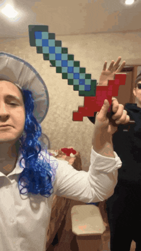 a man wearing a blue wig and a white hat holds a pixelated sword