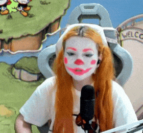 a woman with a clown face painted on her face