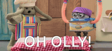 two stuffed animals are standing next to each other and the words holly are on a checkered tablecloth