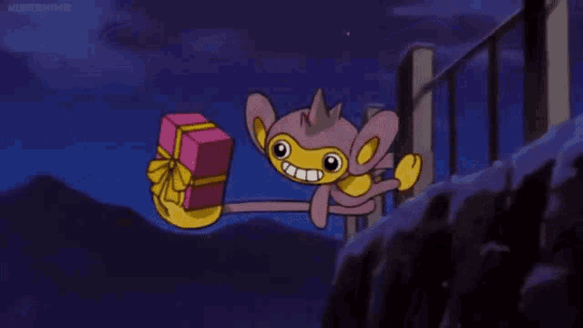 a cartoon monkey is holding a pink gift box in his hand .