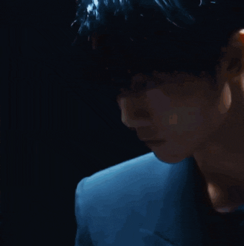 a blurry picture of a man 's face with a black background