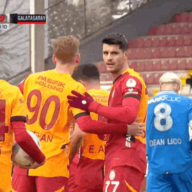 a group of soccer players with one wearing number 90