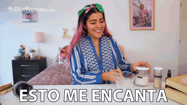 a woman sitting at a table with the words " esto me encanta " written on the bottom
