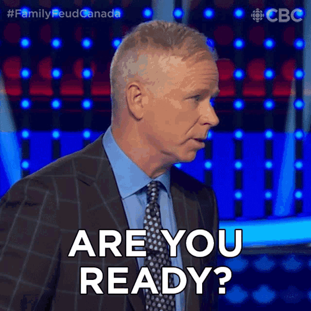 a man in a suit and tie is asking if he is ready