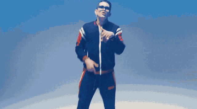 a man wearing sunglasses and a jacket with the word gucci on the front