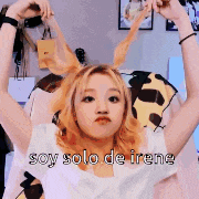 a girl with bunny ears is making a funny face and says soy solo de irene .