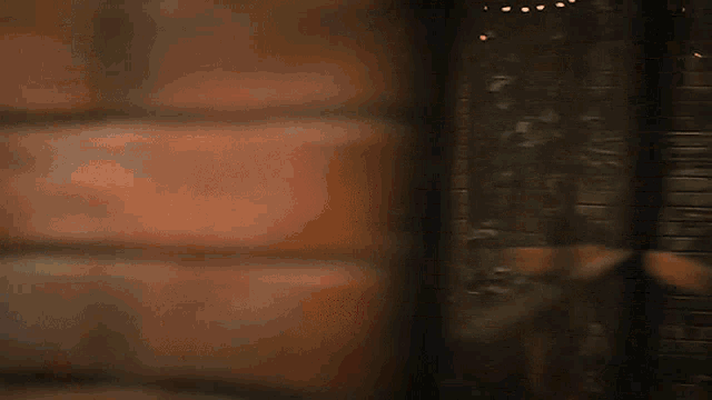 a close up of a brick wall with a few bricks visible
