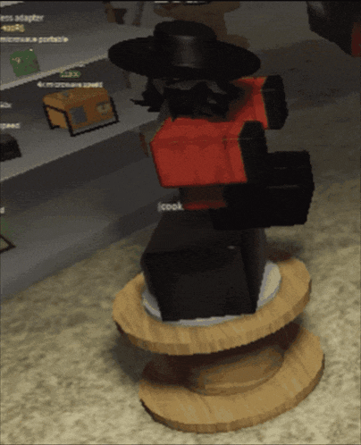 a video game character is standing on a stack of wooden spools with the word cook written on the bottom