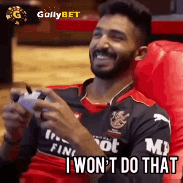 a man is sitting in a chair playing a video game and says `` i won t do that '' .