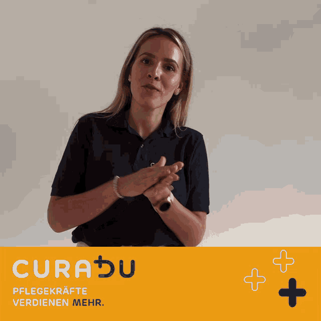 a woman wearing a blue curadu shirt is smiling