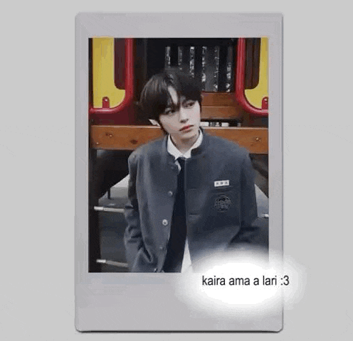 a boy in a school uniform is standing in front of a playground in a polaroid picture .