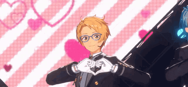 a man with glasses making a heart with his hands