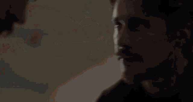 a close up of a man 's face with a blurred background