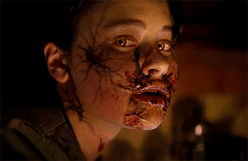 a close up of a person 's face with blood on it .