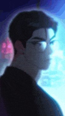 a blurry picture of a man wearing glasses with a blue background
