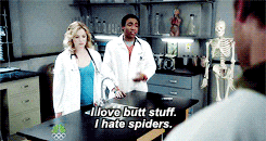 a man in a lab coat says " i love butt stuff i hate spiders " in front of a skeleton