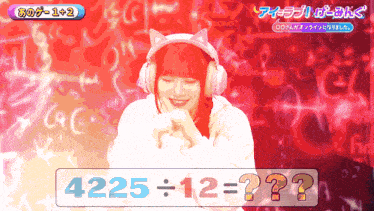a girl wearing headphones stands in front of a screen that says 4220 = 12 = ?