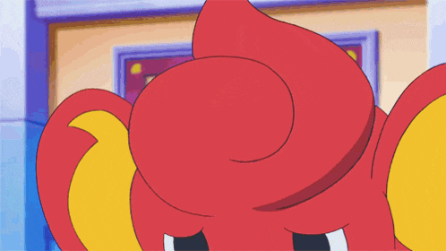 a close up of a cartoon character with a red and yellow head