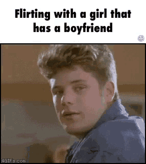 a gif of a man flirting with a girl that has a boyfriend .