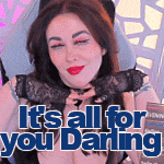 a woman is sitting in a chair with the words `` it 's all for you darling '' written on the bottom .