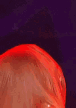a blurry picture of a woman with red lipstick
