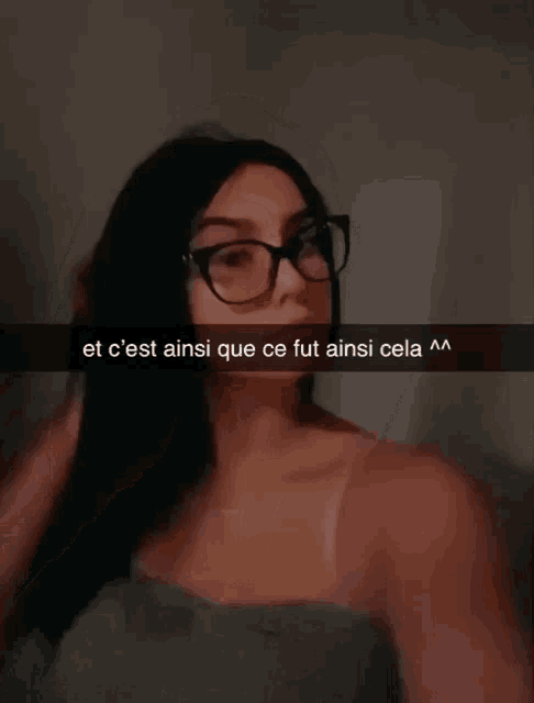 a woman wearing glasses has a caption that says et c'est ainsi que ce fut ainsi cela m