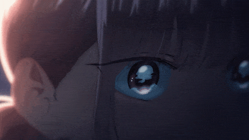 a close up of a girl 's blue eyes with a tear coming out of them