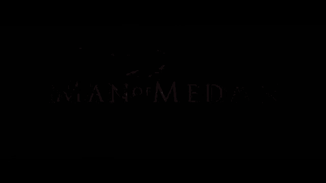 a black background with the words man of medan written in white