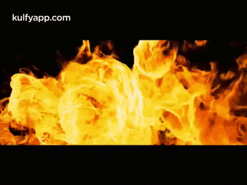 a close up of a fire with a black background
