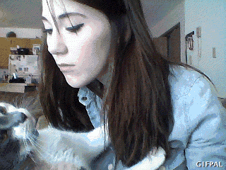 a woman holding a cat with a gifpal watermark