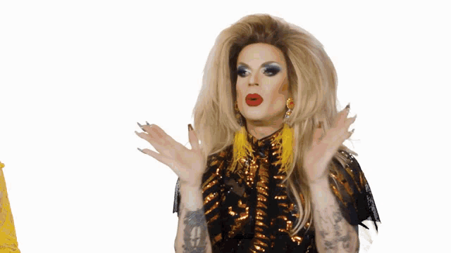 a tv screen shows a drag queen with the words come above her