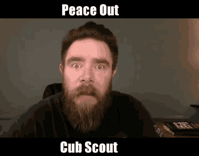 a man with a beard says peace out cub scout on the screen