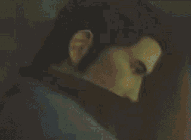 a blurry picture of a man 's face with a red collar